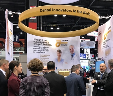 People gathered around the Argen Refining booth at the Chicago Dental Society Meeting.